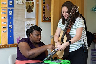 A teacher using music as a learning aid.